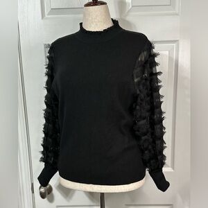 Sioni Milano Black Sweater chic ruffled fringe on sheer sleeves. Cowel neck